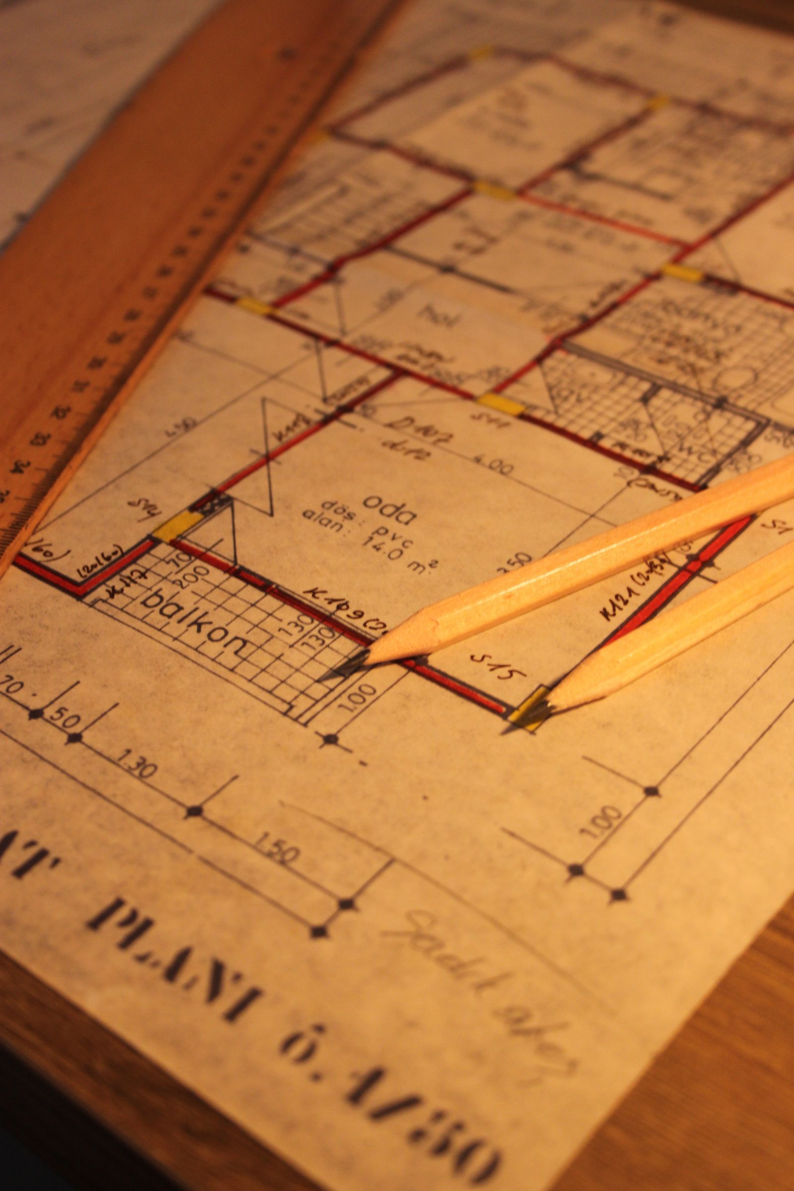 Architectural floor plan blueprint with ruler and pencils